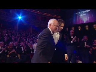timothée chalamet helps james ivory up the stage